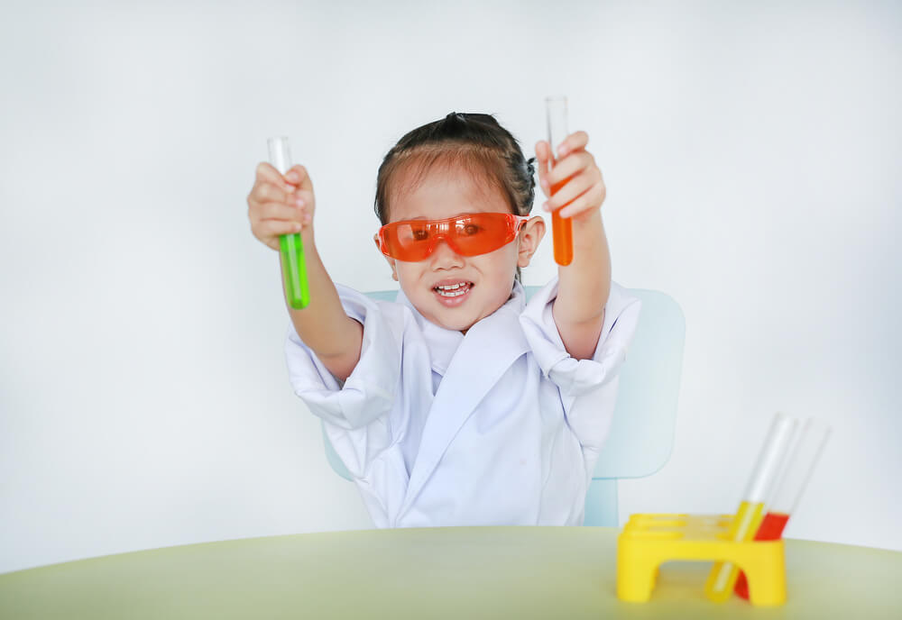 little girl playing science - learning disability activities at home